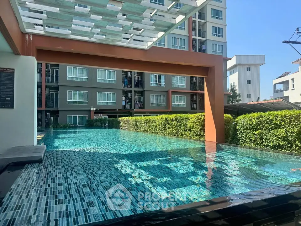 Modern condominium with luxurious swimming pool and lush greenery