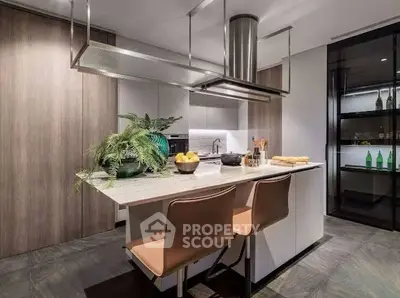 Modern kitchen with sleek island and stylish seating in luxury apartment