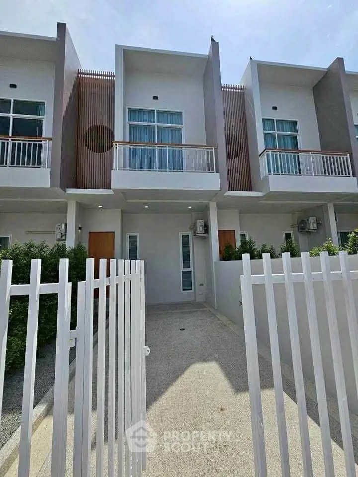 Modern townhouse exterior with sleek design and private entrance