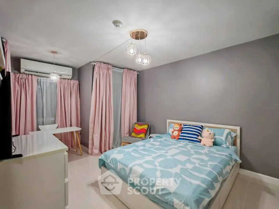 Charming bedroom with modern decor and soft lighting, perfect for relaxation.
