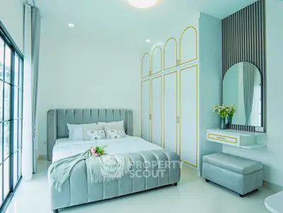 Luxurious bedroom with elegant decor and large windows for natural light