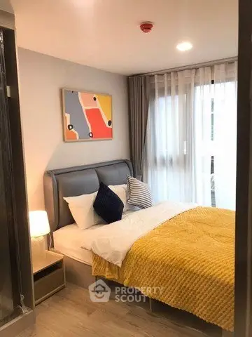 Cozy modern bedroom with stylish decor and natural light