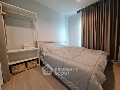 Cozy bedroom with modern decor and ample natural light, featuring a comfortable bed and stylish curtains.