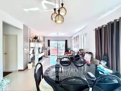 Spacious modern living room with elegant dining area and ample natural light