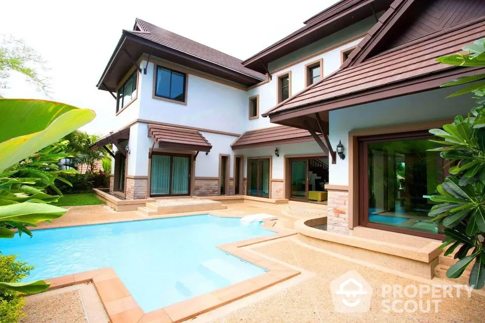 Luxurious modern villa with private pool and lush garden, perfect for serene living.