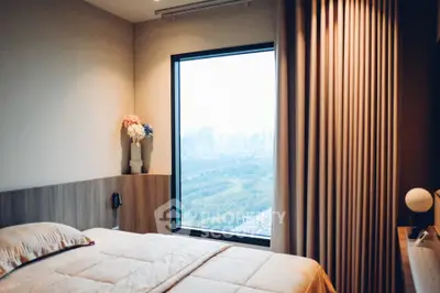 Cozy bedroom with city view and elegant decor