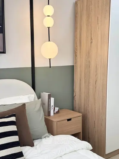 Modern bedroom with stylish lighting and cozy decor