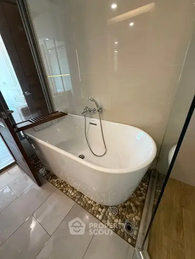 Luxurious bathroom with elegant freestanding bathtub and modern fixtures