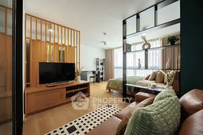 Modern studio apartment with open layout, featuring stylish decor and natural light.