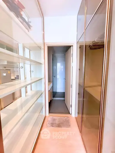 Spacious walk-in closet with ample shelving and elegant design