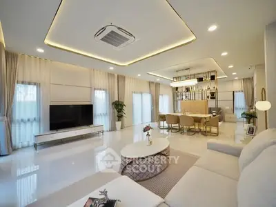 Luxurious open-plan living room with modern decor and elegant lighting