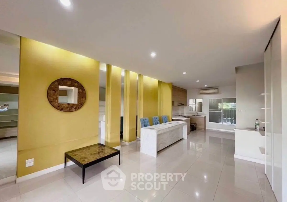 Spacious modern living room with open layout and stylish decor in a contemporary apartment.