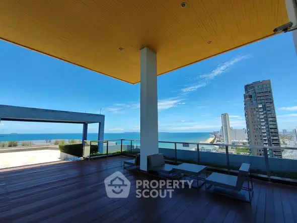 Stunning rooftop terrace with ocean view and modern seating area.