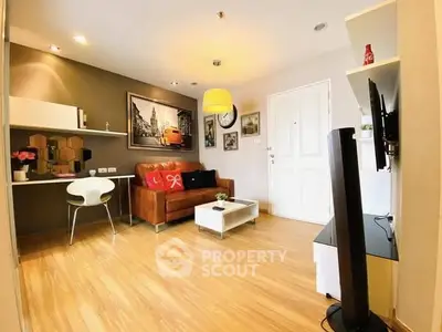 Stylish modern living room with wooden flooring and chic decor