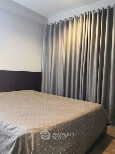 Cozy bedroom with elegant curtains and stylish bedding