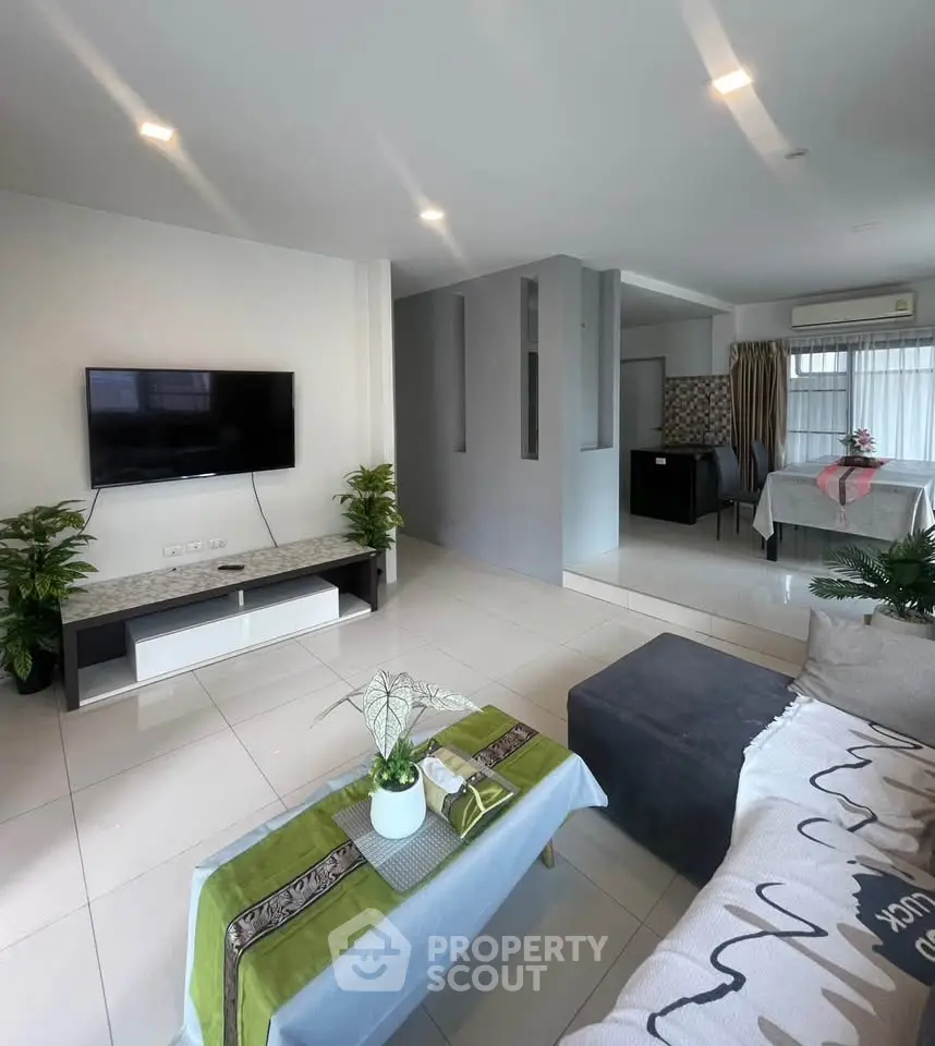 Spacious modern living room with sleek design and natural light