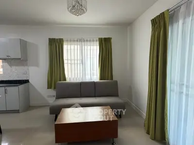 Modern living room with sleek sofa and elegant curtains, perfect for cozy gatherings.