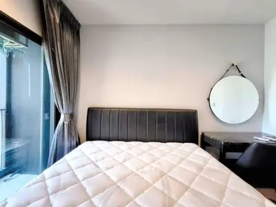 Modern bedroom with sleek design and large window for natural light