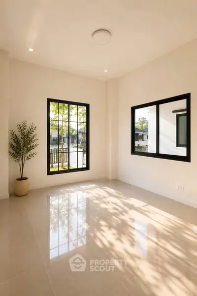 Bright empty room with large windows and glossy tiled floor, perfect for customization.