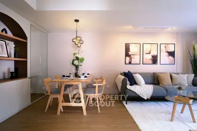 Stylish modern living room with cozy seating and elegant dining area, perfect for entertaining.
