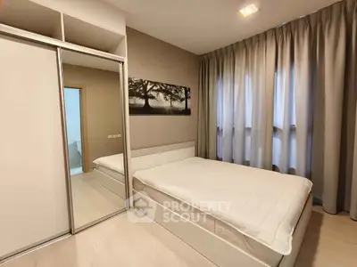 Modern bedroom with mirrored wardrobe and large window with curtains