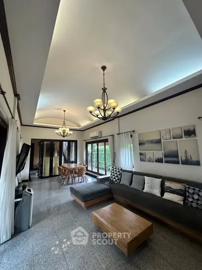 Spacious living room with elegant lighting and modern decor