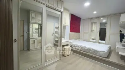 Spacious bedroom with elegant built-in wardrobes and modern decor