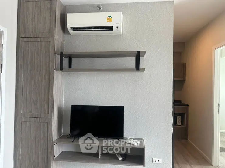 Modern apartment interior with air conditioning and TV setup