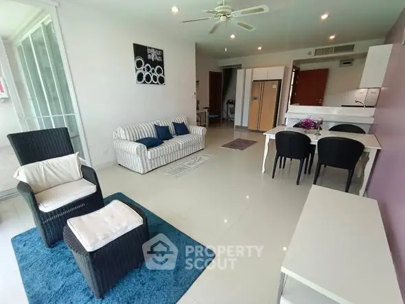 Spacious modern living room with open kitchen and stylish furniture