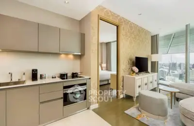 Modern open-layout kitchen and living room with city view, elegant decor, and stylish furniture.