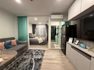 Modern studio apartment with open layout, cozy living area, and stylish bedroom.