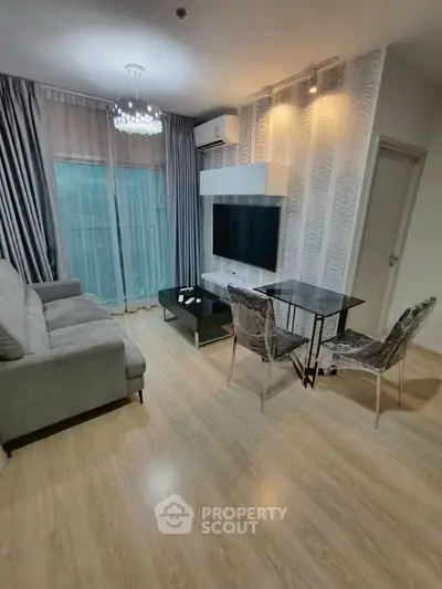 Modern living room with sleek furniture and stylish decor, featuring a cozy sofa and elegant dining area.