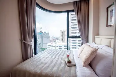 Luxurious bedroom with stunning city view and elegant decor