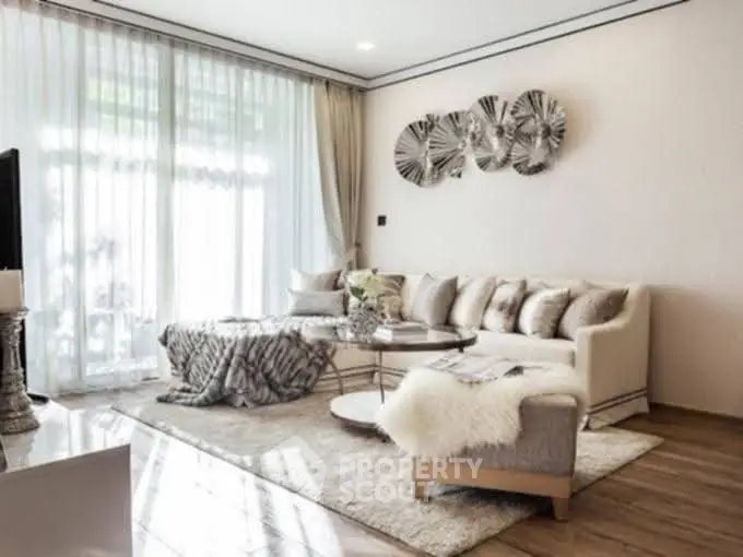 Luxurious living room with elegant decor and large windows