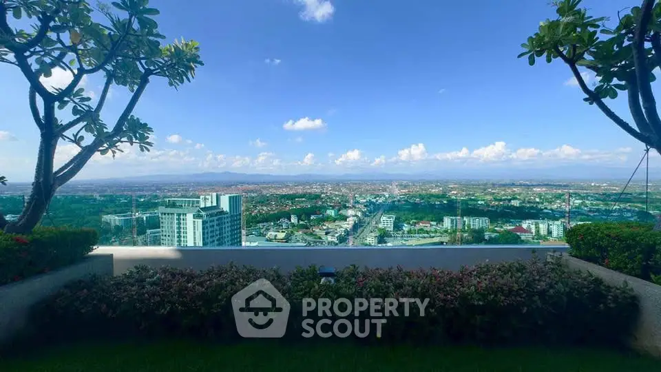 Stunning panoramic cityscape view from a lush rooftop garden, perfect for relaxation and enjoying urban vistas.