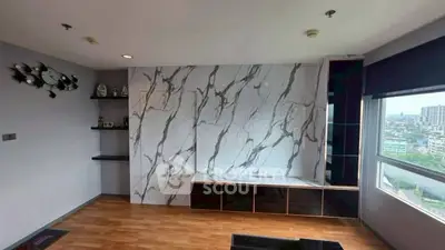 Modern living room with marble accent wall and city view