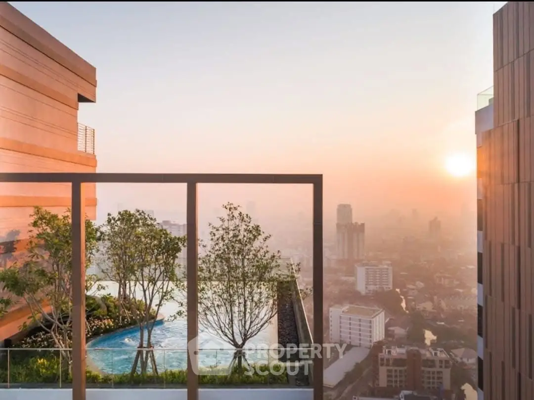 Stunning rooftop pool with panoramic city view at sunset, perfect for luxury living.