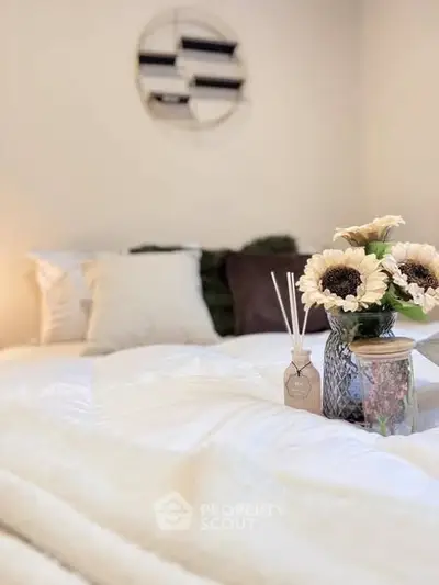 Cozy bedroom with elegant decor and plush bedding for ultimate comfort.