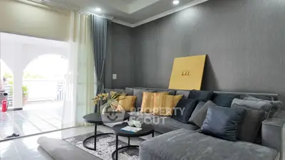 Modern living room with stylish gray sofa and elegant decor