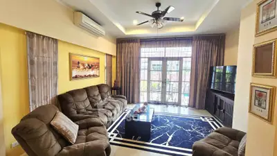Spacious living room with plush seating and modern decor