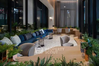 Luxurious modern living room with elegant decor and lush greenery