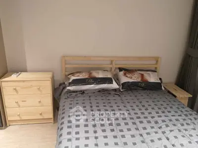 Cozy bedroom with stylish wooden furniture and elegant bedding