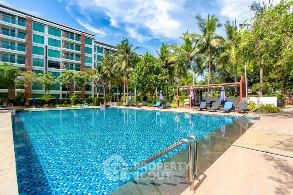 Luxurious condominium with stunning pool and lush tropical landscaping