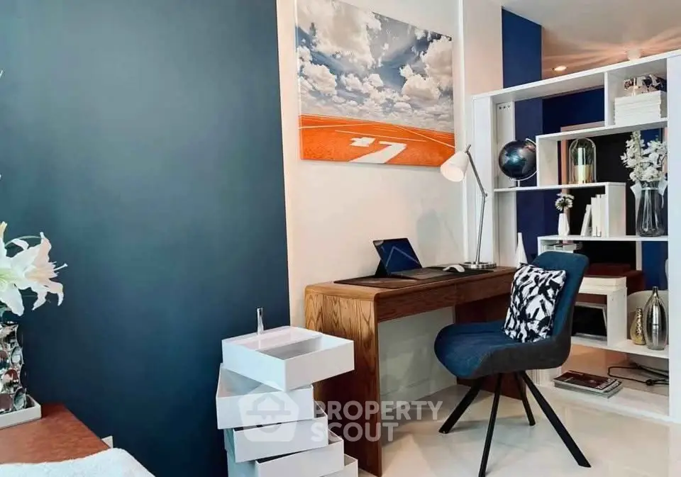 Modern study room with stylish decor and sleek furniture in a contemporary apartment.