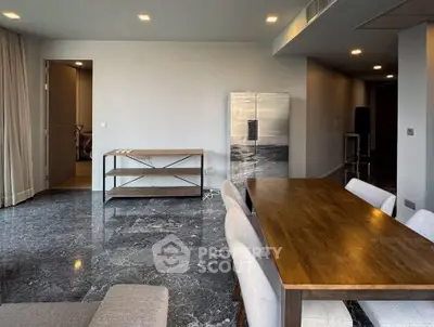 Spacious modern dining area with elegant marble flooring and stylish wooden furniture.