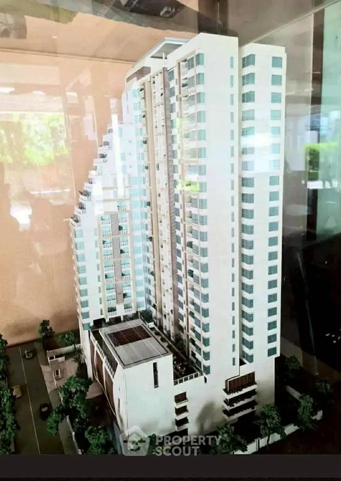 Stunning architectural model of a modern high-rise building with sleek design and urban appeal.