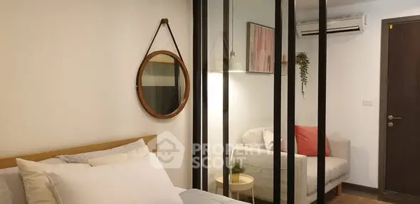 Modern bedroom with stylish decor and cozy seating area