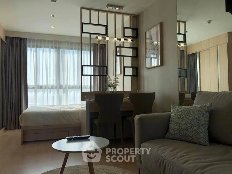 Modern studio apartment with cozy living area and stylish decor