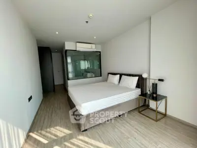 Modern minimalist bedroom with glass partition and stylish decor