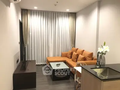 Modern living room with stylish furniture and elegant decor in a contemporary apartment.